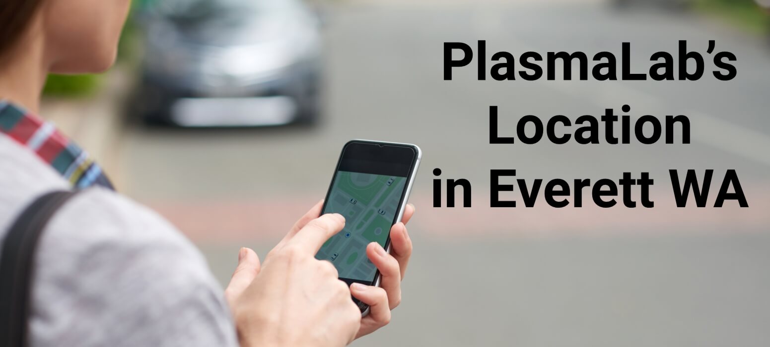 Woman using cell phone for map to PlasmaLab in Everett WA