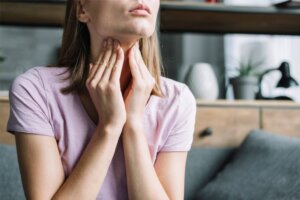 A woman with allergic asthma and anxiety is also diagnosed with vocal chord dysfunction. 
